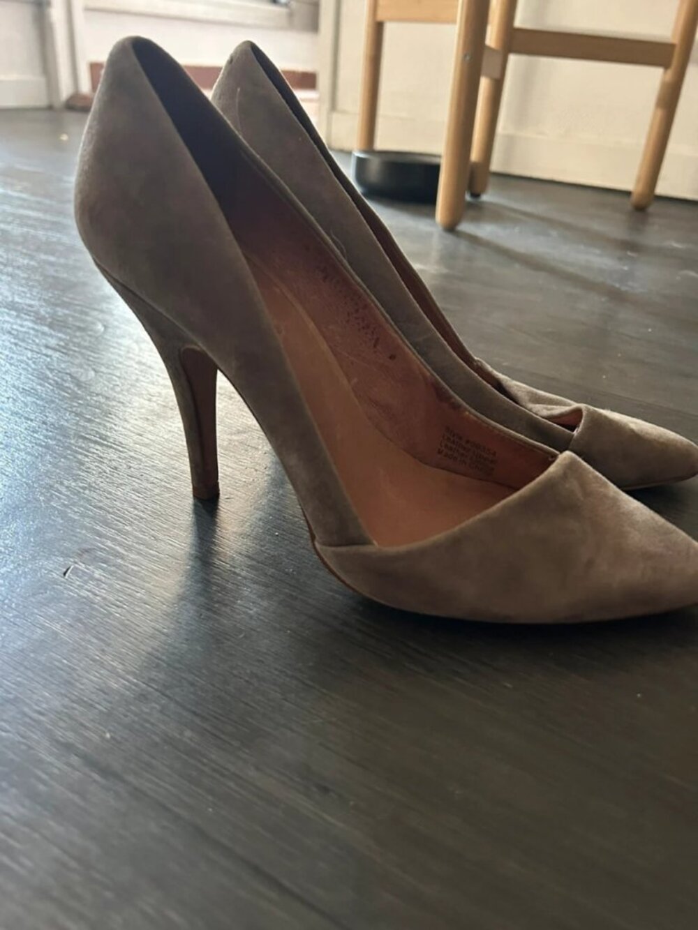 Beige suede high-heeled shoes with a pointed toe